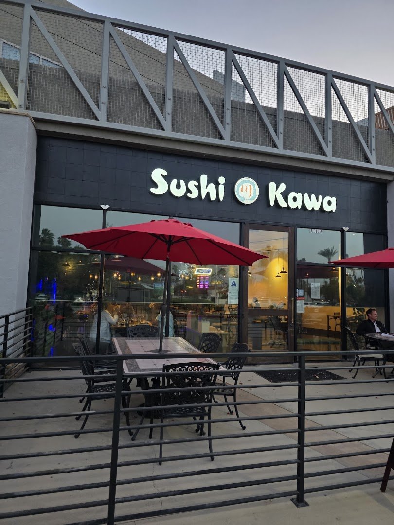 Sushi restaurant interior with bar seating.