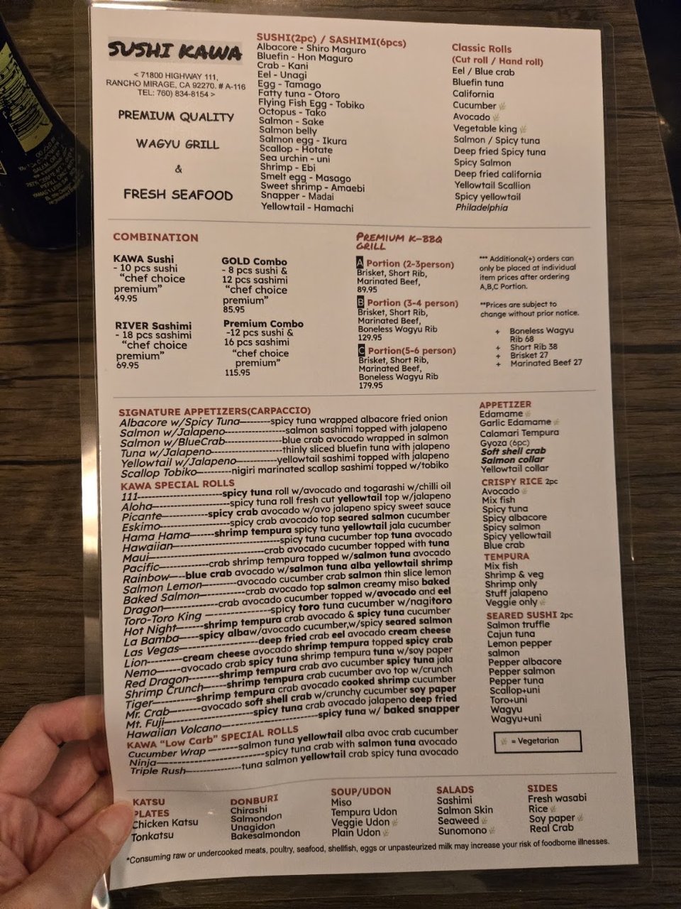 Menu page with sushi categories and rolls.