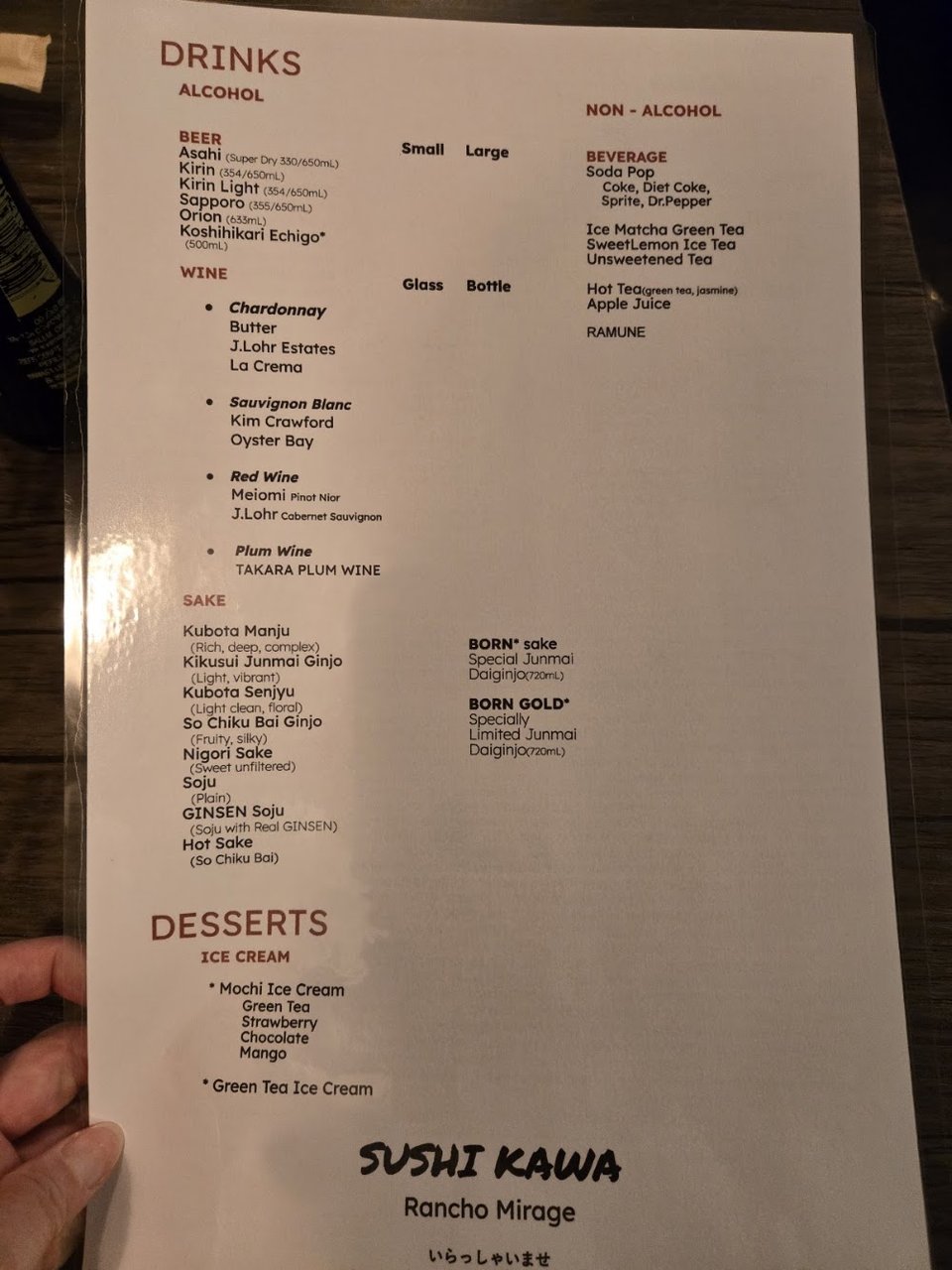Printed sushi menu with appetizer sections.